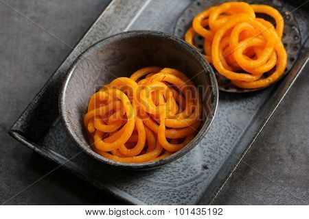 Jilebi Selective focus - Indian Sweet on a rustic background