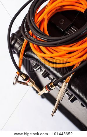 Close-up of guitar amplifier with jack cable.