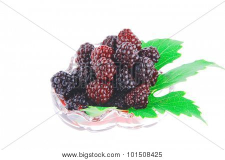 image of wild berry on tranparent glass over white