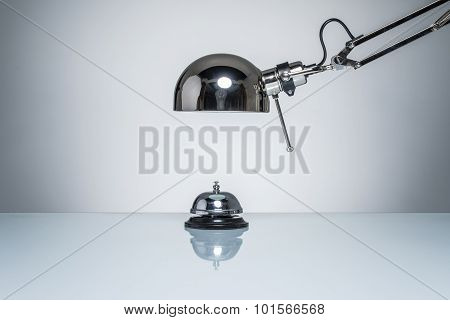 Lighting Up Hotel Bell For Calling Service With Desk Lamp