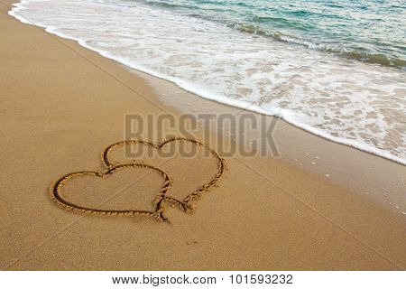 Two Love Hearts on Sand.
