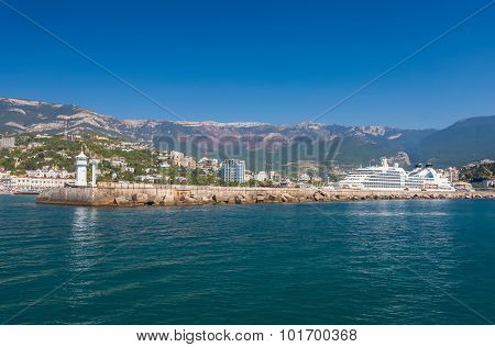 Big ship evening sailing off from Yalta port