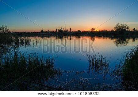 Sunset over calm lake