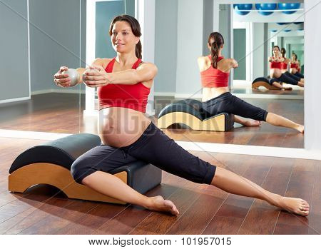 pregnant woman pilates side stretchs exercise with Wave corrector