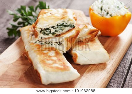 Borek or pita, filo pastry with cheese and spinach filling