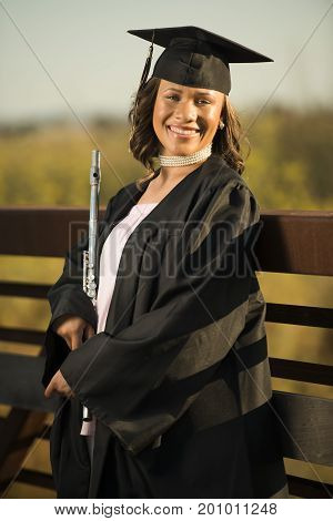 Young lady with instrument ready for graduation