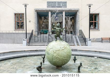STOCKHOLM, SWEDEN - JULY 4, 2017: The Eastman institute and the Eastman fountain in Stockholm.  The institute was donated by George Eastman to provide free dental care to children.