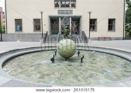 STOCKHOLM, SWEDEN - JULY 4, 2017: The Eastman institute and the Eastman fountain in Stockholm.  The institute was donated by George Eastman to provide free dental care to children.