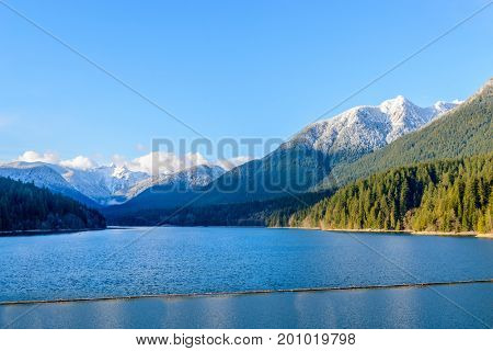 Snow Mountains and Capilano Lake in Vancouver British Columbia Pacific Northwest.