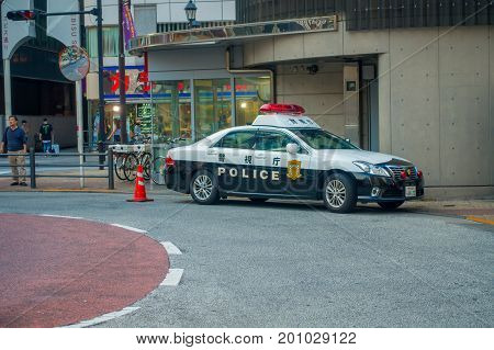 TOKYO, JAPAN JUNE 28 - 2017: Tokyo Metropolitan Police Department car parked in front of the central station of Tokyo, Japan.