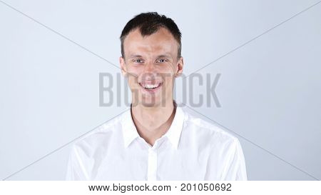 Happy Businessman Smiling And Laughing At Studio