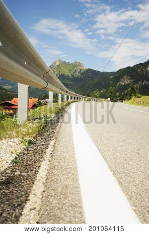 Road in the Tyrolean Alps in the direction of the mountain Aggenstein