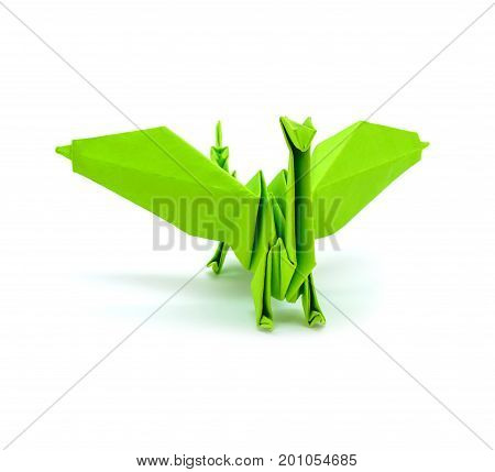 Photo of beautiful origami green gragon isolated on white background