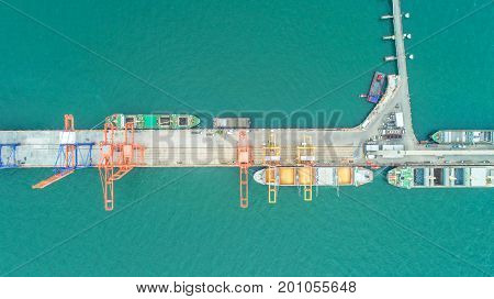 oil tanker gas tanker in the high sea.Refinery Industry cargo ship. top view aerial view Thailand in import export LP Goil refinery Logistics and transportation with working crane bridge in harbor