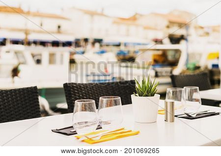Served table at summer terrace seaside cafe