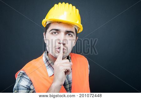 Constructor Wearing Equipment Showing Silence Gesture
