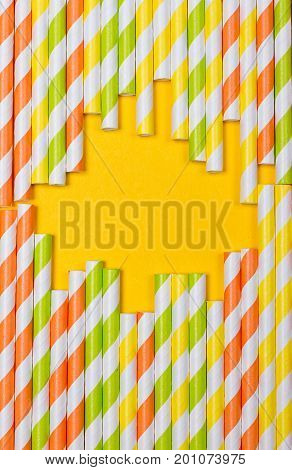 close-up colorful fancy drinking straws fancy tube for party on the yellow background