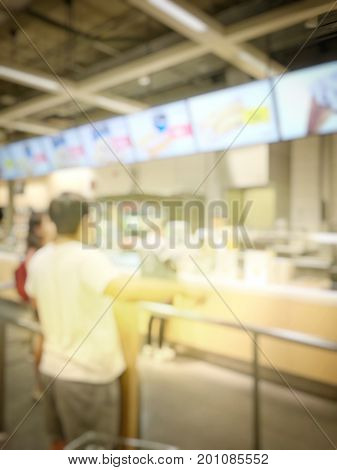 Blurred Image Of People Queue Up Waiting In Line To Buy Fast Food In Fastfood Store Or Seflservice R