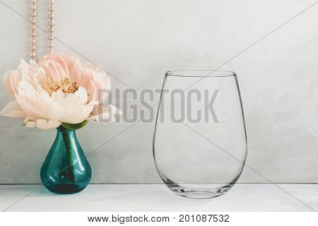 Mockup - Stemless Wine Glass, Next To A Peony In A Vase