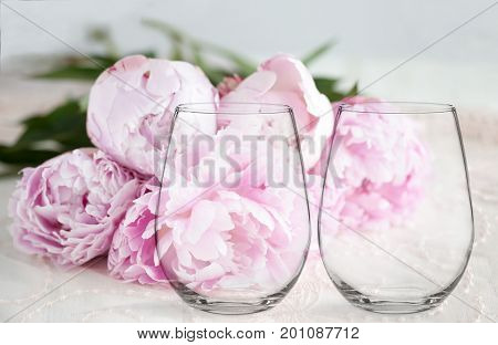 Mockup - 2 Stemless Wine Glasses, With Peonies Behind