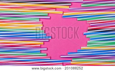 close-up colorful fancy drinking straws fancy tube for party on the pink background