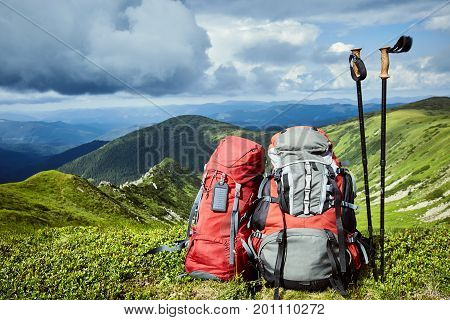 Backpacks in the mountains with views of the mountains.
