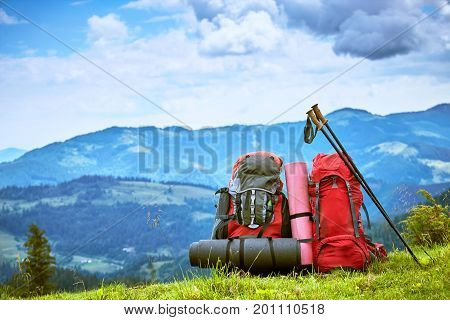 Backpacks in the mountains with views of the mountains.