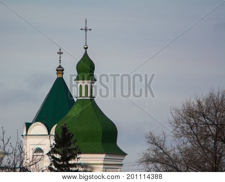 Domes of orthodox church under blue sky