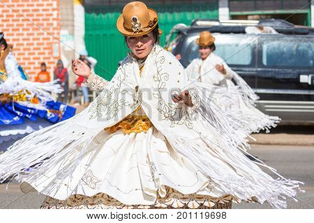 PUNO, PERU - AUGUST 07: Authentic Colorful Carnival on the streets of Puno, Peru near the high altutude Titicaca lake on August 7th, 2017