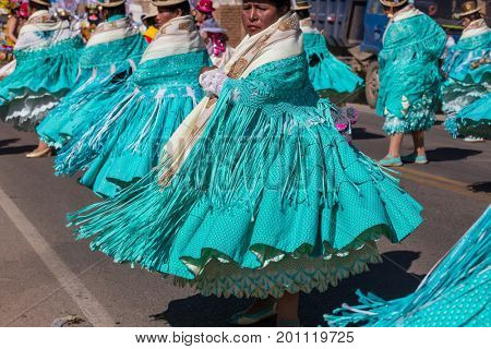 PUNO, PERU - AUGUST 07: Authentic Colorful Carnival on the streets of Puno, Peru near the high altutude Titicaca lake on August 7th, 2017