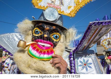 PUNO, PERU - AUGUST 07: Authentic Colorful Carnival on the streets of Puno, Peru near the high altutude Titicaca lake on August 7th, 2017