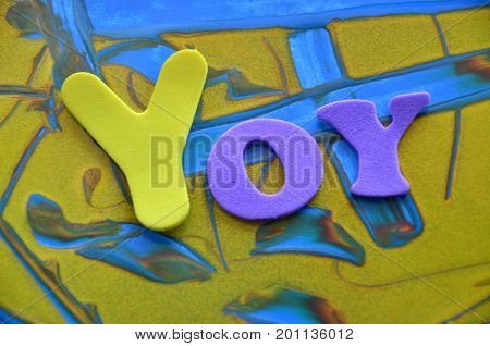WORD YOY ON A   ABSTRACT COLORFUL BACKGROUND