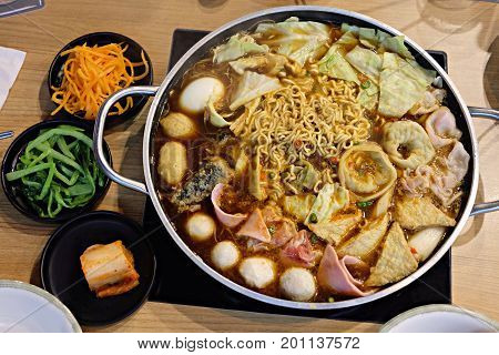 Budaejjigae delicious Korean noodles in a pot with Vegetable set for Family. Korean food.
