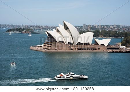 SYDNEY,NSW,AUSTRALIA-NOVEMBER 20,2016: Sydney Opera House at Bennelong Point with nautical vessels in Sydney, Australia