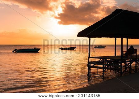 Resting on remote Paradise beachMauritius island.vintage style.