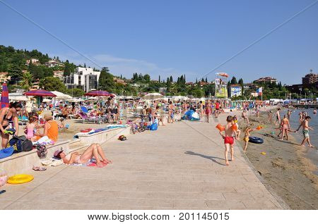Portoroz Slovenia - 20 July 2016: Beach in Portoroz destination resort with bathing people in Slovenia