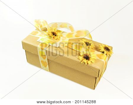 Decorative wrappage of gift box, decorated by bowl and flowers