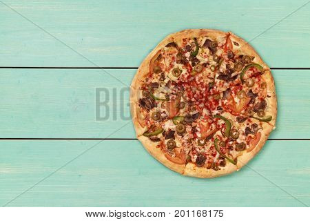 Pizza on wooden. Wooden table top view. On the table are the food for cooking. Healthy food. Dietetic foods. Above view on food. Hot Homemade Pepperoni Pizza Ready to Eat