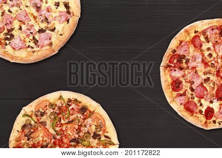 Pizza on wooden table top view. Fast food Delicious. Post blog social media. View from above with copy space. Banner template layout mockup top view on pizza. Pizza ready to eat.
