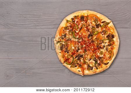 Pizza on wooden table top view. Fast food Delicious. Post blog social media. View from above with copy space. Banner template layout mockup top view on pizza. Pizza ready to eat.