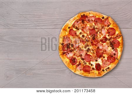Pizza on wooden table top view. Fast food Delicious. Post blog social media. View from above with copy space. Banner template layout mockup top view on pizza. Pizza ready to eat.