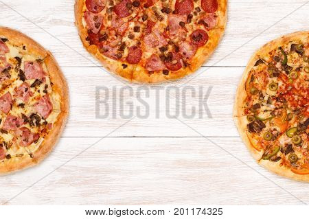 Pizza on wooden table top view. Fast food Delicious. Post blog social media. View from above with copy space. Banner template layout mockup top view on pizza. Pizza ready to eat.