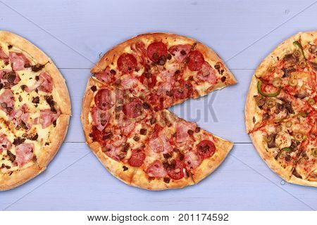 Pizza on wooden table top view. Fast food Delicious. Post blog social media. View from above with copy space. Banner template layout mockup top view on pizza. Pizza ready to eat.