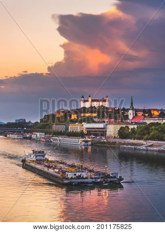 Cityscape of Bratislava Slovakia at Sunset as Seen from a Bridge over Danube River towards Btatislava Castle