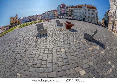 TIMISOARA ROMANIA - AUGUST 24 2017: View of one part at Union Square in Timisoara Romania with old buildings. Trinity Statue german Dom and serbian vicariate in background.