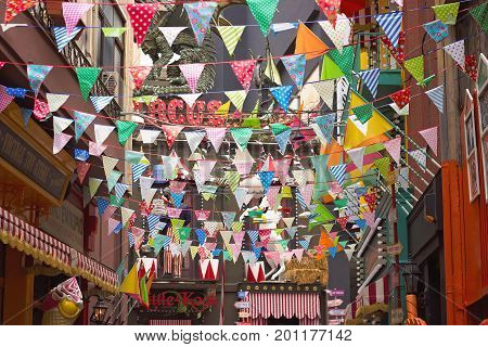 ATHENS GREECE - JULY 16 2017: Colorful flags decoration in streets at Psiri area Athens city near Monastiraki
