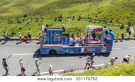 Col de PeyresourdeFrance- July 23 2014: X-tra vehicle during the passing of the Publicity Caravan on the road to Col de Peyresourde in Pyrenees Mountains in the stage 17 of Le Tour de France on 23 July 2014.