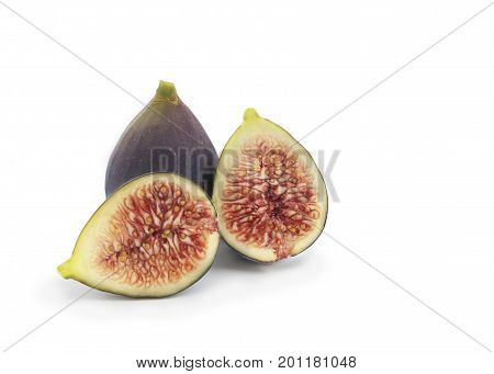 pair of common fig from the mulberry family whole and sliced isolated on a white background