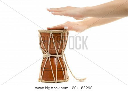 Female hands little drum on white background isolation