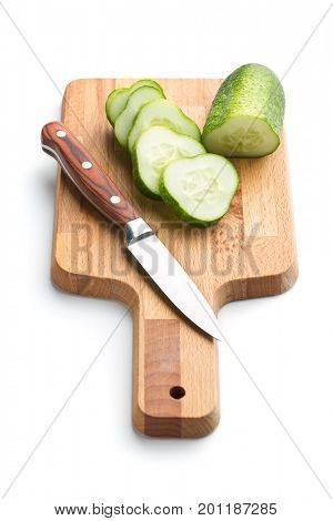 Fresh sliced cucumber isolated on white background. Cucumber on cutting board with knife.